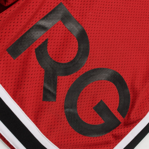Red sports jersey with black 'PYQ' logo on a white background