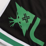 Close-up of a sports jersey with a green logo on a black background