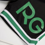 Black and green sports jersey with 'PG' logo on a white background