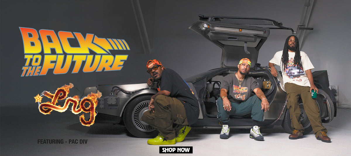 Three men posing with a black DeLorean time machine from Back to the Future in a studio setting, featuring large 'Back to the Future' and 'Eng' branding on the left and a 'Shop Now' button at the bottom.