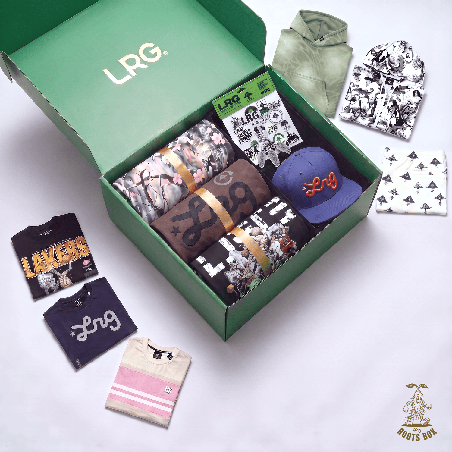 An open green LRG. box filled with folded apparel and accessories, surrounded by matching clothing laid out on a white background.