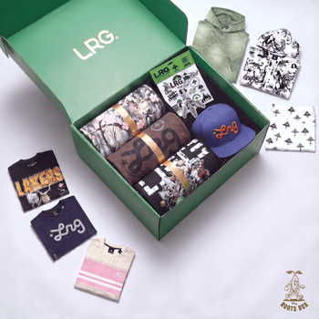 An open green LRG. box filled with folded apparel and accessories, surrounded by matching clothing laid out on a white background.