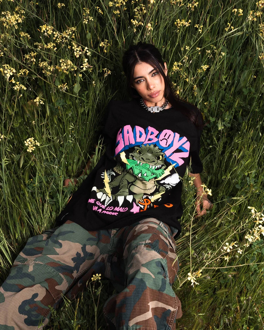 LRG woman wearing a black graphic tee outdoors