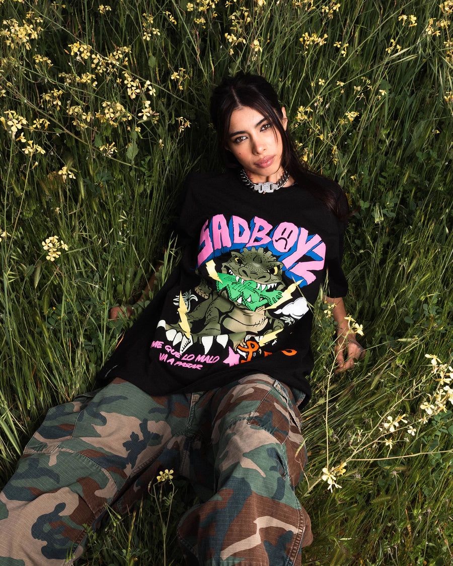 LRG woman wearing a black graphic tee outdoors